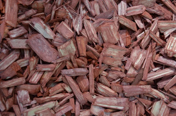 Virutas de madera rojas como fondo texturizado — Foto de Stock