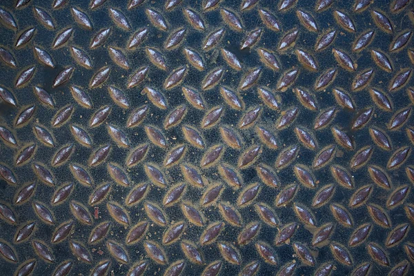 Aluminiowe ciemne liście z kształtami romb. — Zdjęcie stockowe