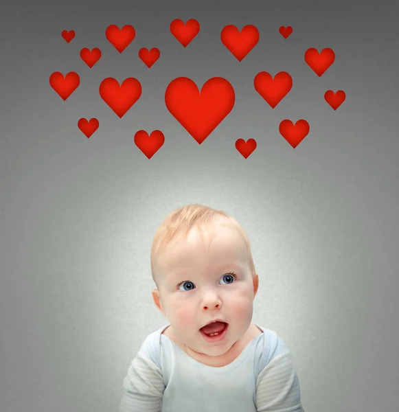 Baby with hearts Stock Picture