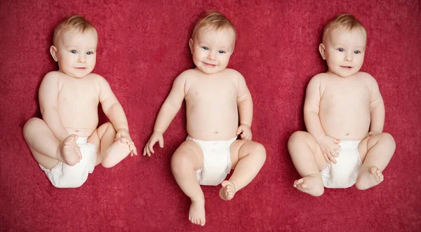 Three boys on red — Stock Photo, Image