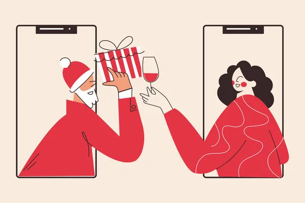 Yılbaşı online tatil kutlaması, sıcak şarap ya da yılbaşı ve sanal parti ile yapılır. Bir bardak şarabı olan bir kadın ve hediyeli bir Noel Baba. Tatil çevrimiçi video görüşmesi