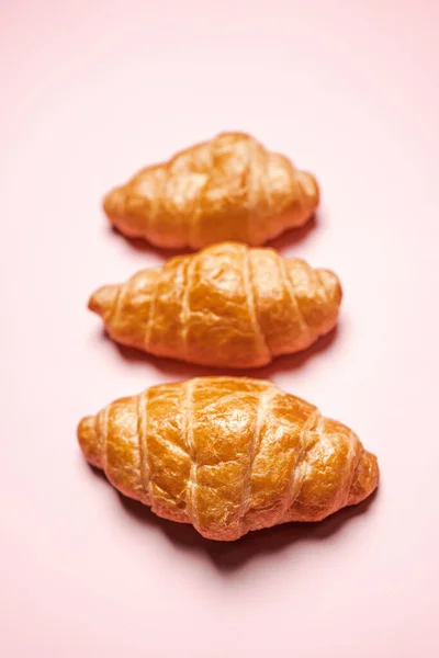 Three Fresh Baked Crispy Golden Buttery Croissants Isolated Pink Background — Stock Photo, Image