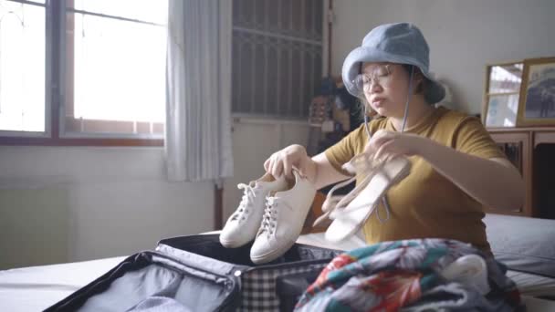 Asian Woman Wearing Hat Looks Sneakers Sandals She Chooses Wear — Stock Video