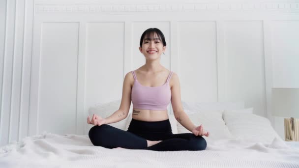 Young Smiling Attractive Sporty Asian Woman Practicing Yoga Bed Doing — Stock Video