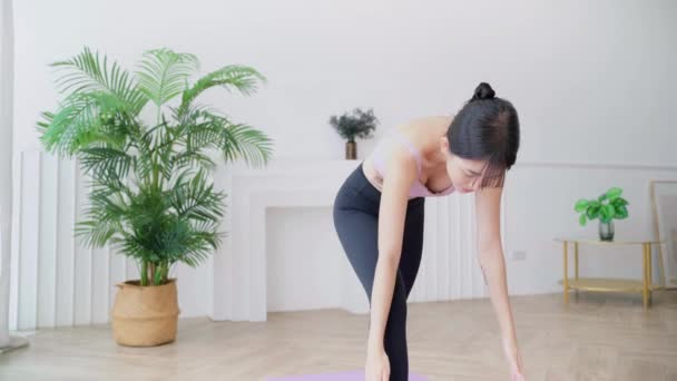 Young Smiling Attractive Sporty Asian Woman Practicing Yoga Doing Virabhadrasana — Wideo stockowe