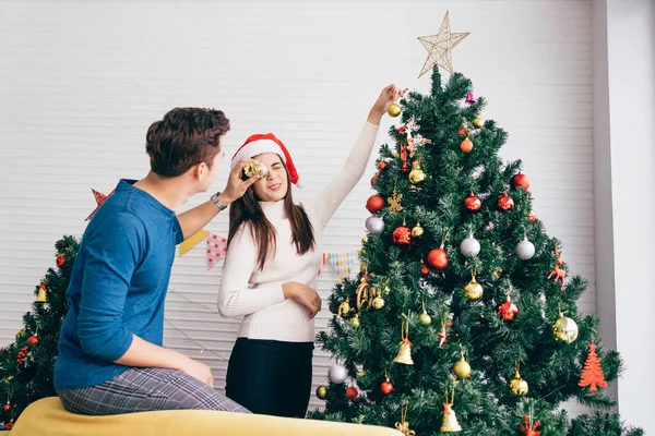 Happy Young Couple Having Fun Decorating Various Baubles Christmas Tree — Stock Photo, Image