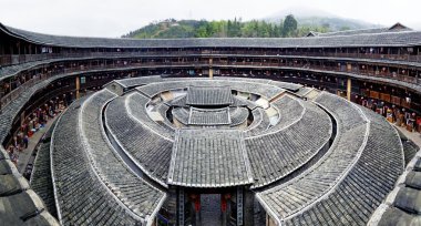 Hakka Roundhouse tulou walled village located in Fujian, China clipart