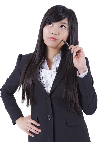 Unge asiatiske forretningskvinder tænker, foran den hvide backgr - Stock-foto