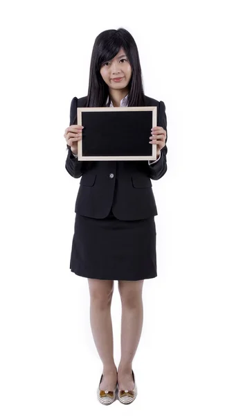 Asian woman holding board, black screen for texture — стоковое фото