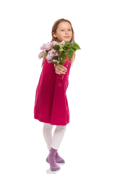 Beautiful young girl with lilac flowers — Stock Photo, Image