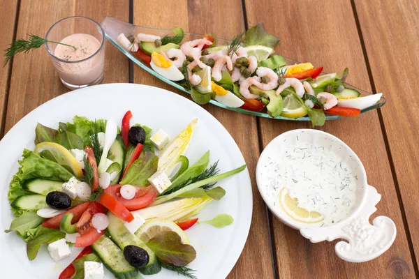 Greek salad and shrimp cocktail — Stock Photo, Image