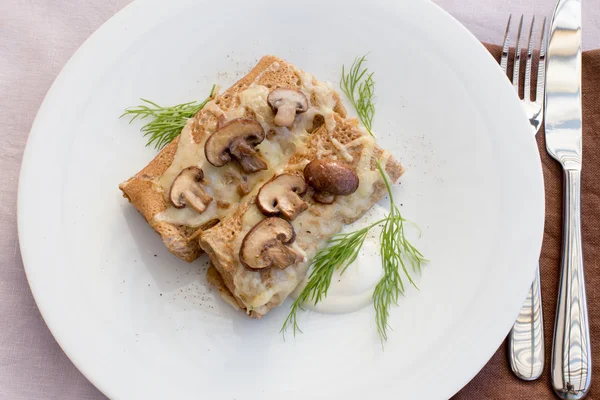 Salty pancakes with mushrooms — Stock Photo, Image