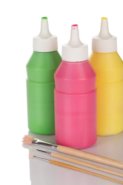 Μπουκάλια χρωμάτων και μολύβια Φωτογραφία Αρχείου