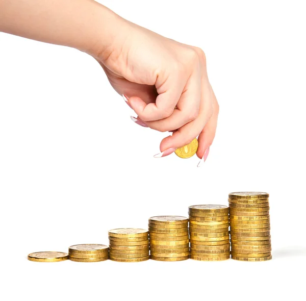 Hand makes a hill of coins — Stock Photo, Image