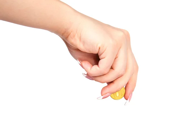 Mano de mujer con una moneda sobre fondo blanco — Foto de Stock