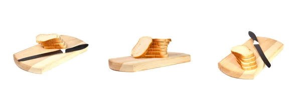 En uppsättning av bröd på en skärbräda — Stockfoto