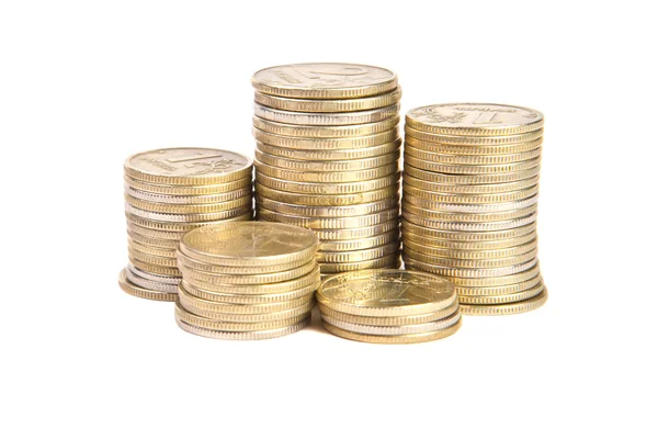 Montones de monedas sobre un fondo blanco — Foto de Stock