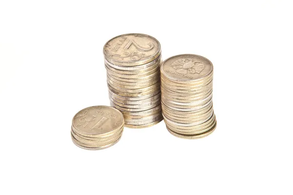 Stacks of coins on a white background — Stock Photo, Image