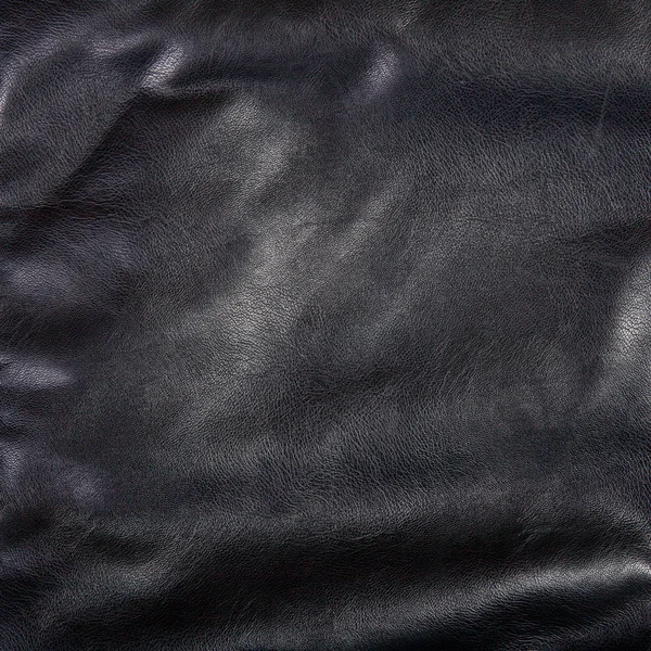 Black leather background with folds — Stock Photo, Image