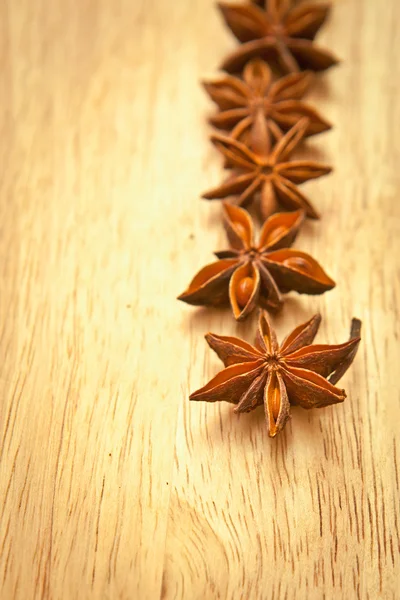 Asterisks anise on a wooden board — Stock Photo, Image