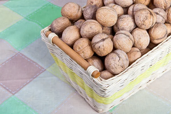 Walnuts in a wicker basket — Stock Photo, Image