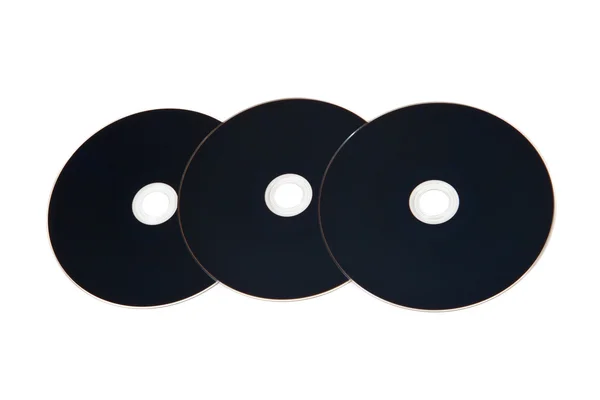Beyaz zemin üzerinde üç optik disk — Stok fotoğraf