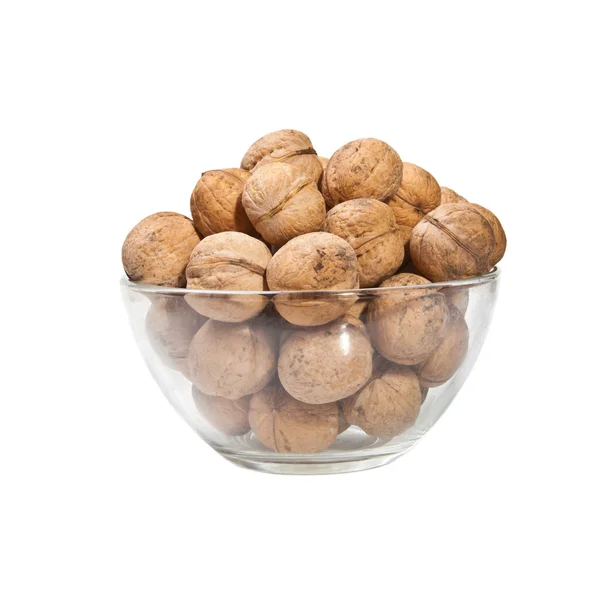 Walnuts in a glass dish on a white background — Stock Photo, Image
