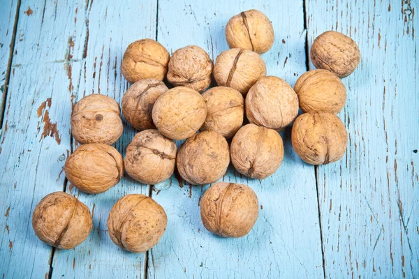 Walnuts on a wooden board — Stock Photo, Image