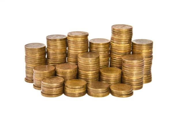 Pile di monete su sfondo bianco — Foto Stock