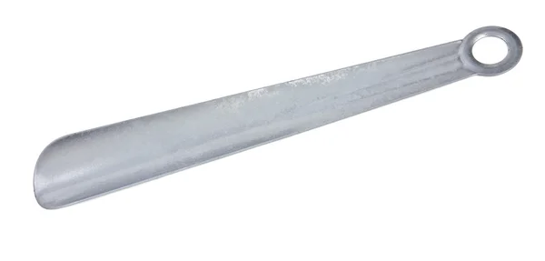 Metal shoehorn em um fundo branco — Fotografia de Stock