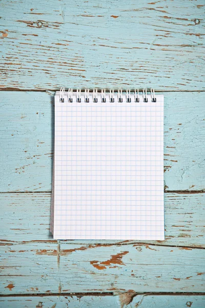 Open notebook on a wooden background — Stock Photo, Image