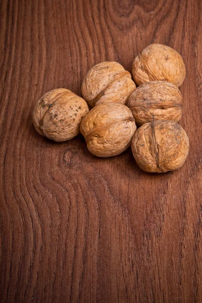 Walnuts on a wooden background — Stock Photo, Image