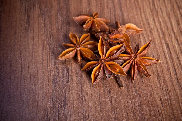 Star anise on a wooden background — Stock Photo, Image