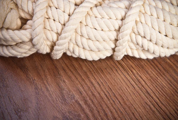 White rope on a wooden background closeup — Stock Photo, Image