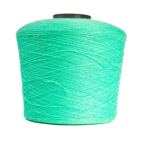 白地に青緑色の糸をリールします。 — ストック写真