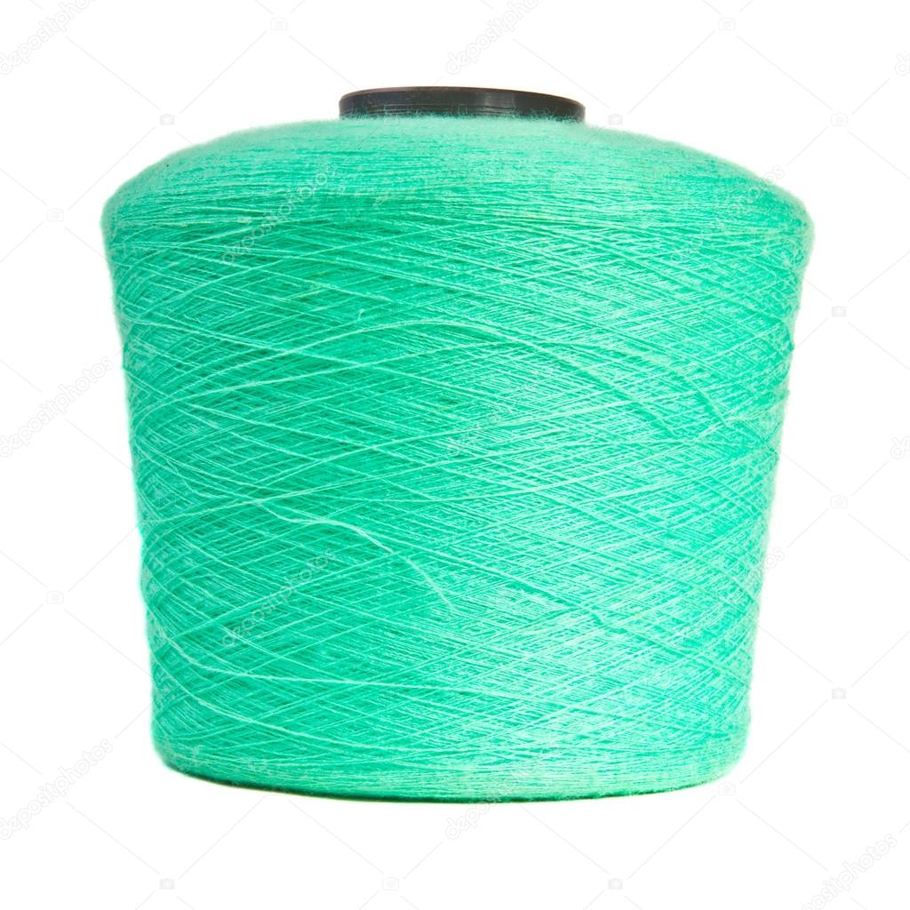 Reel with turquoise yarn on white background