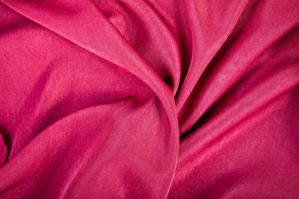 Red textile background with folds — Stock Photo, Image