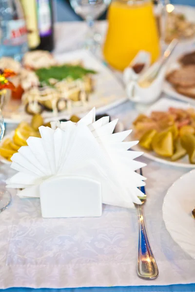 Paper napkins on decorated table — Stock Photo, Image