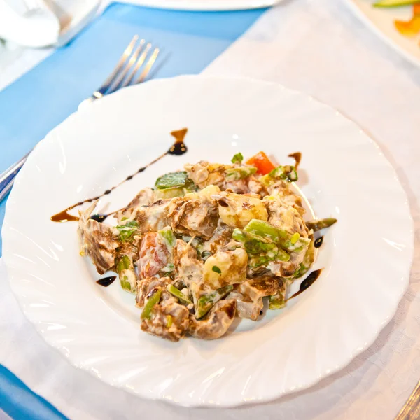 Meat salad on a plate — Stock Photo, Image