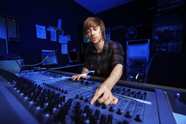 Man using a Sound Mixing Desk clipart
