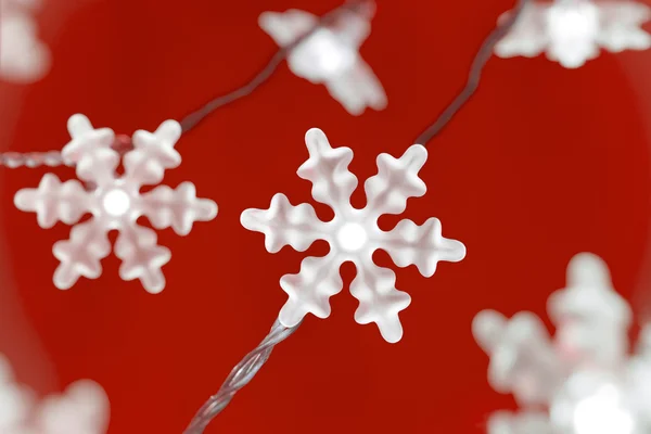 Christmas Snowflake Lights on Red — Stock Photo, Image