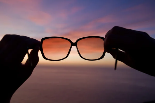 Sunglasses at sunset — Stock Photo, Image
