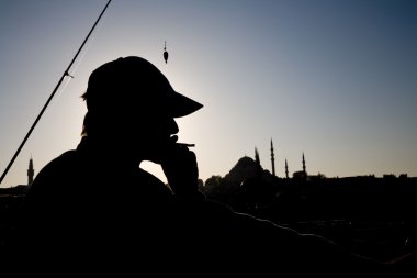 Fisherman on Galata Bridge, Istanbul clipart