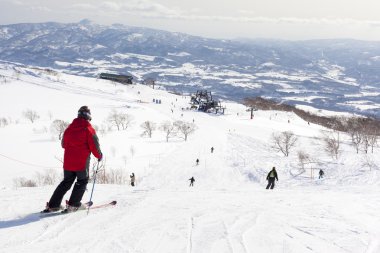 Skiers on Mount Niseko Annupri, Hokkaido, Japan clipart