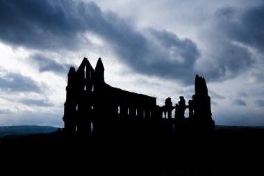 Silhouette of Whitby Abbey with Moody Sky clipart