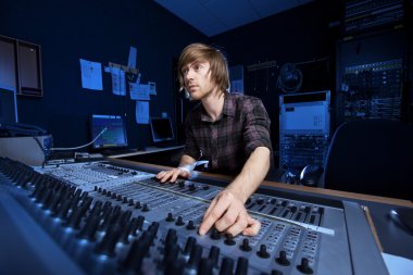Man using a Sound Mixing Desk clipart