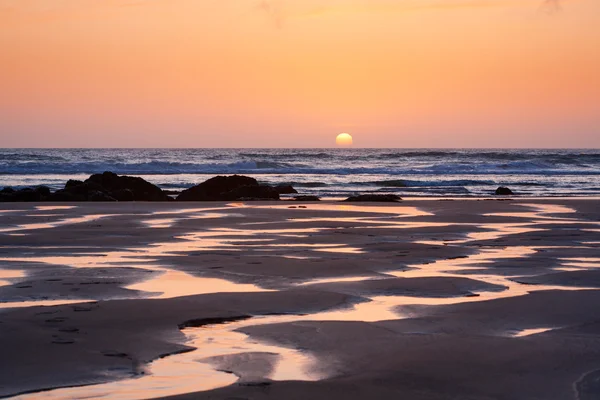 Sunset reflections on Porthtown Beach — Stock Photo, Image