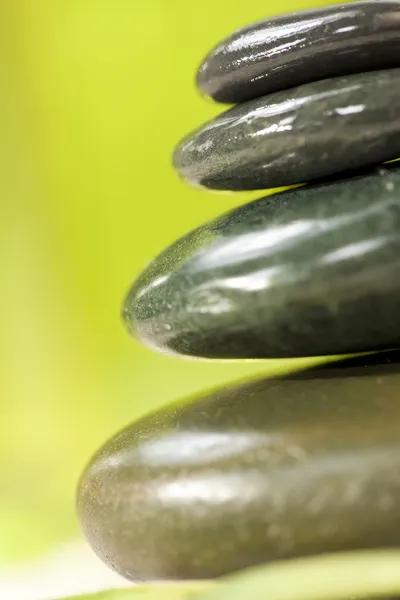 Spa Massage Hot Stones With Green Background — Stock Photo, Image