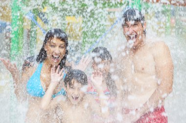 Mother Father Son Daughter Child Family Water Park clipart