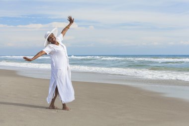 Happy African American Woman Dancing on Beach